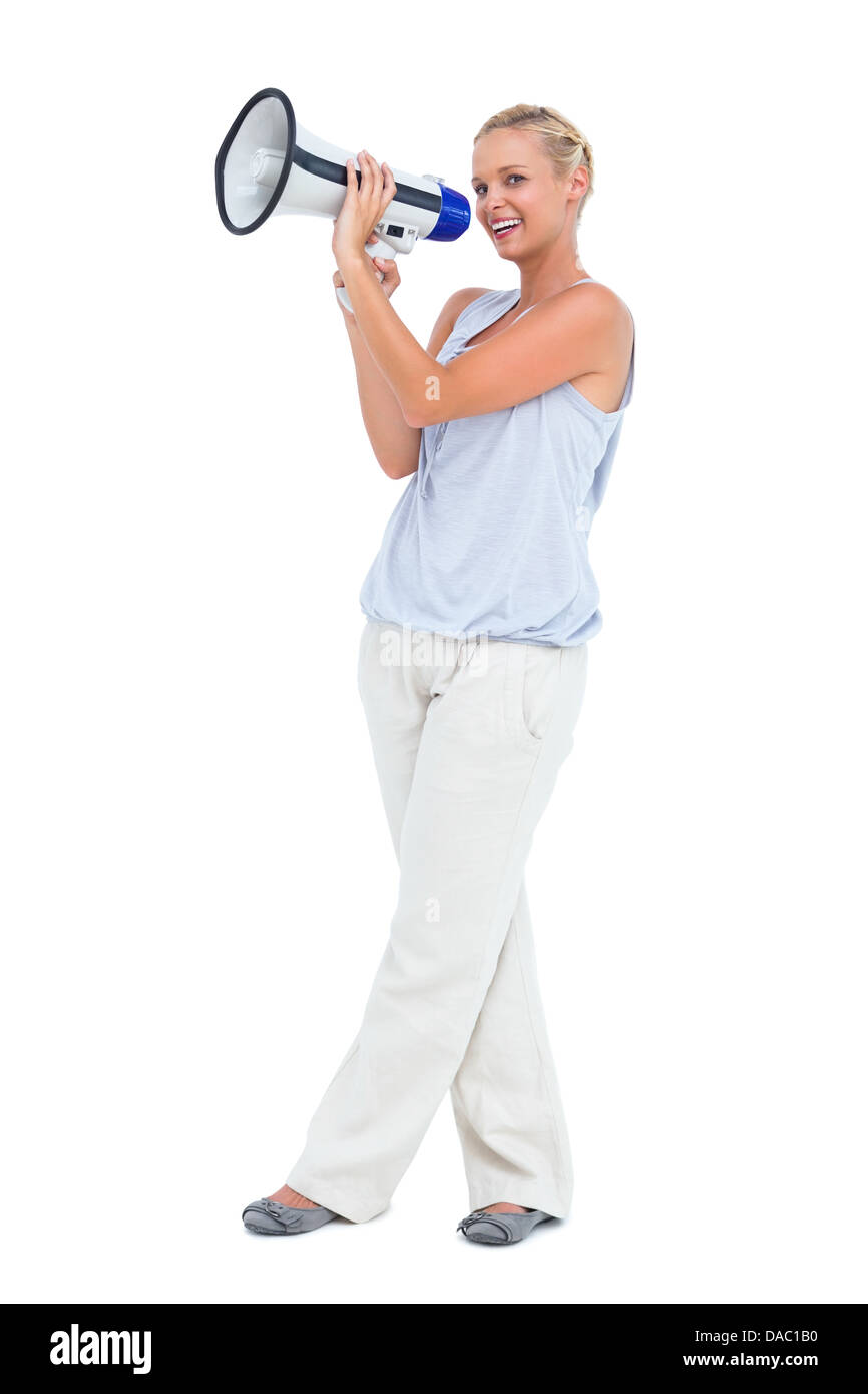 Blondine, durch Megaphon schreien Stockfoto