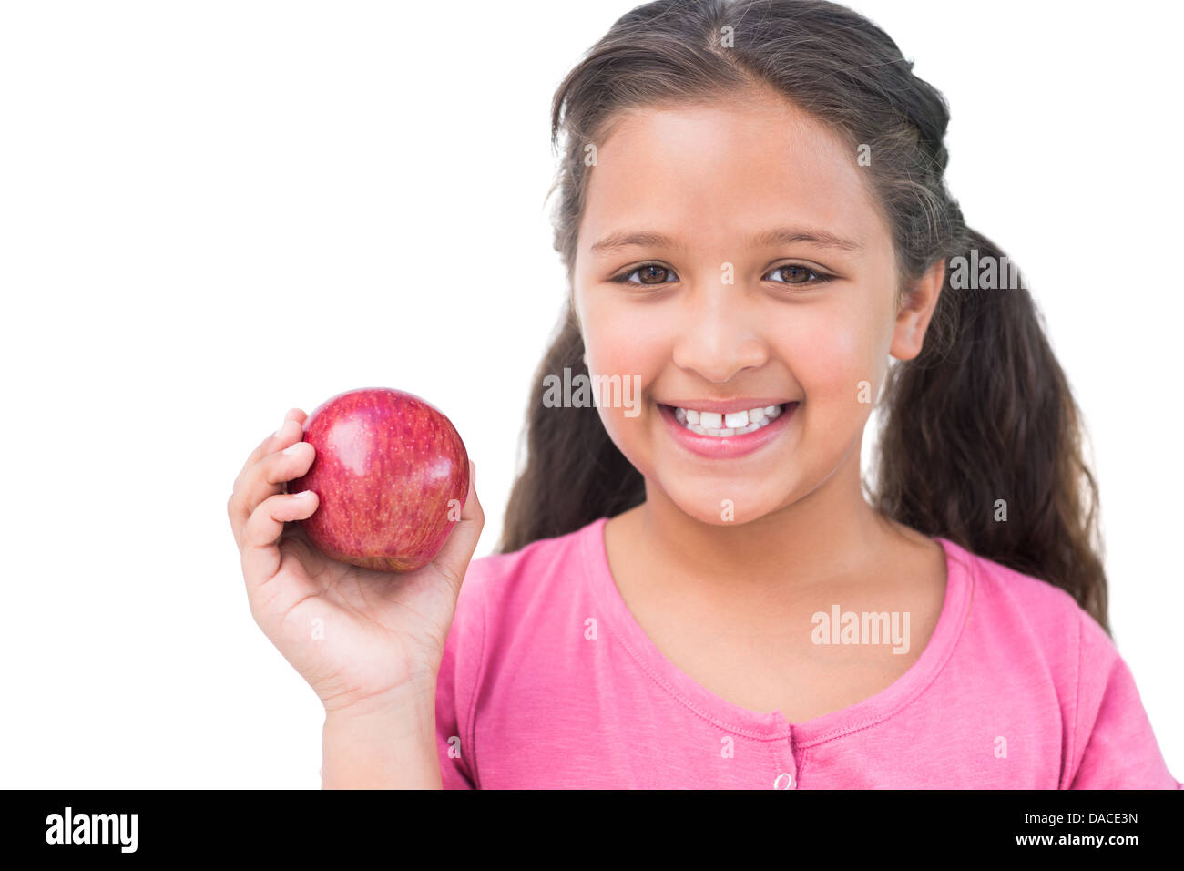 Kleines Mädchen mit Apfel in der hand Stockfoto