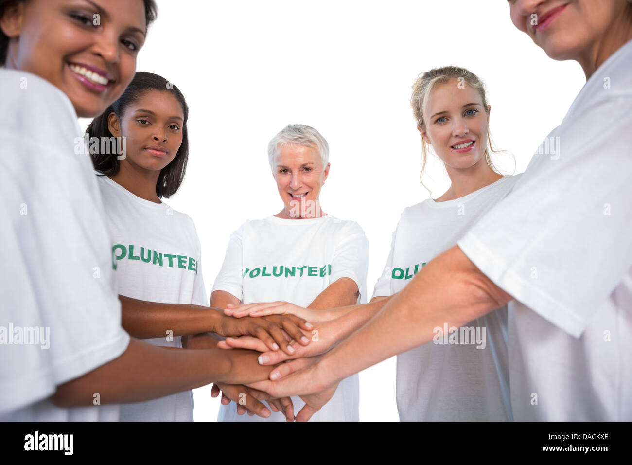 Team der weiblichen Probanden mit Händen zusammen in die Kamera Lächeln Stockfoto