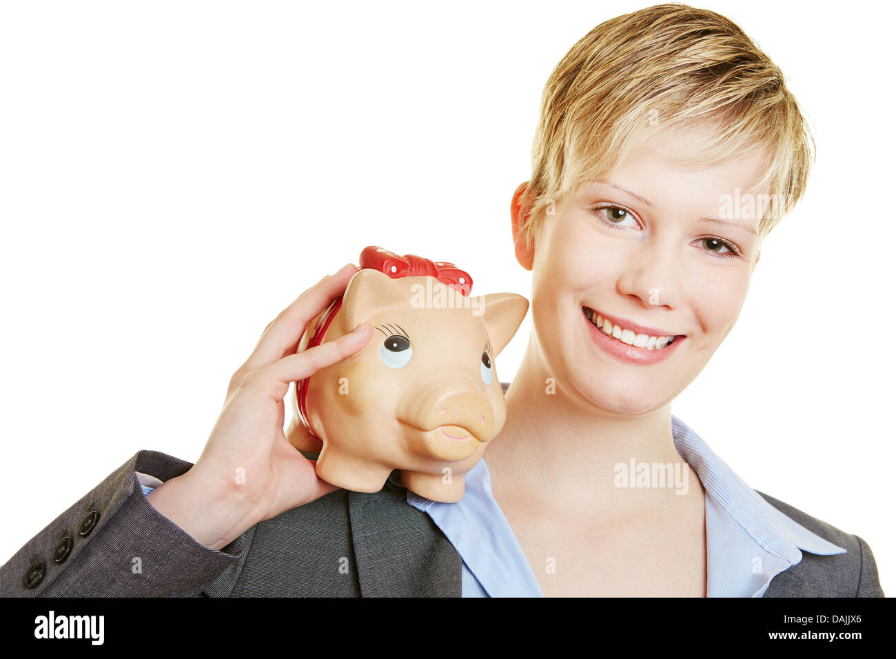 Glückliche junge lächelnde Frau mit ein Sparschwein auf die Schulter Stockfoto