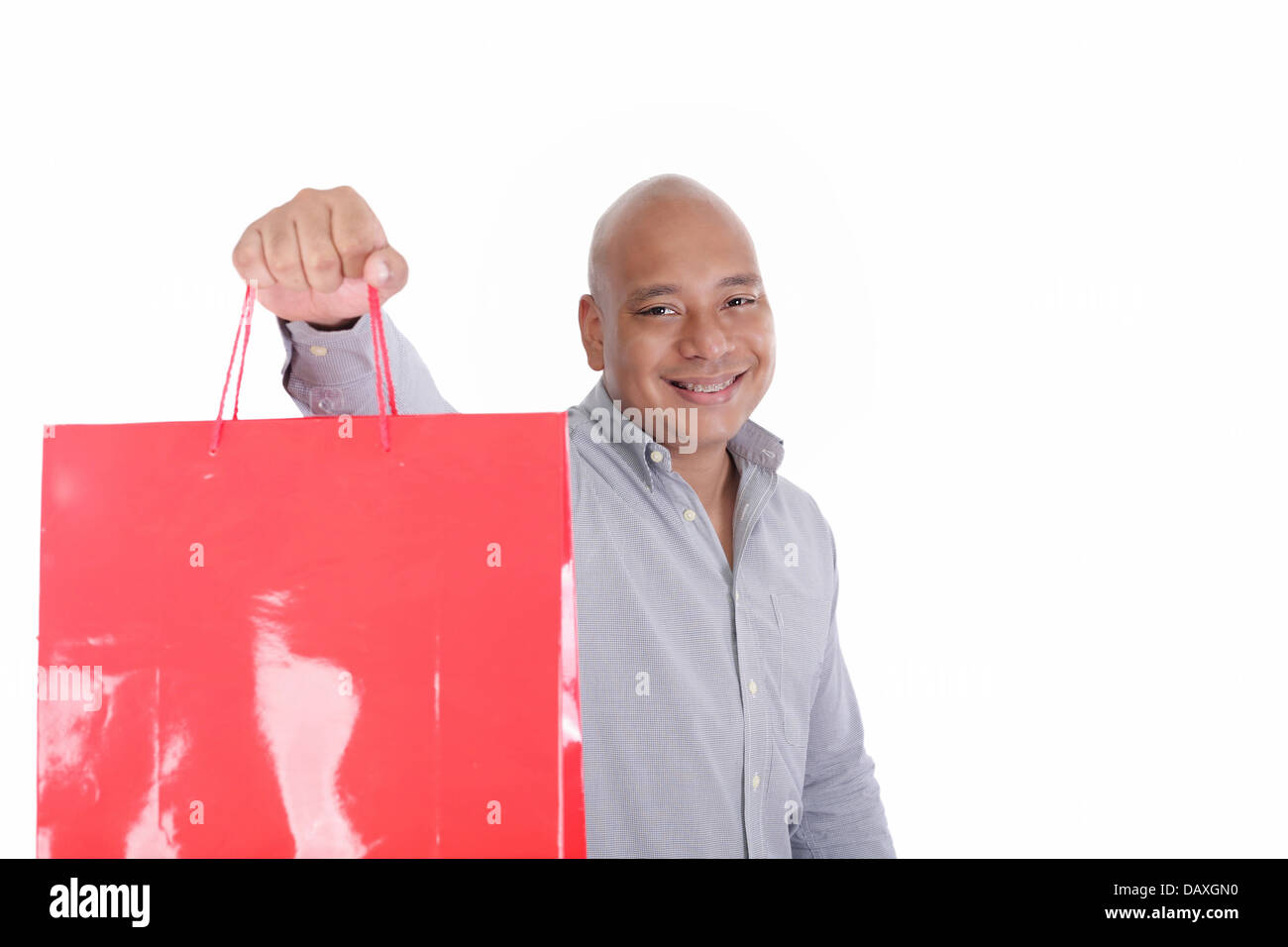 Bild von gut aussehender Mann mit Einkaufstüten Stockfoto