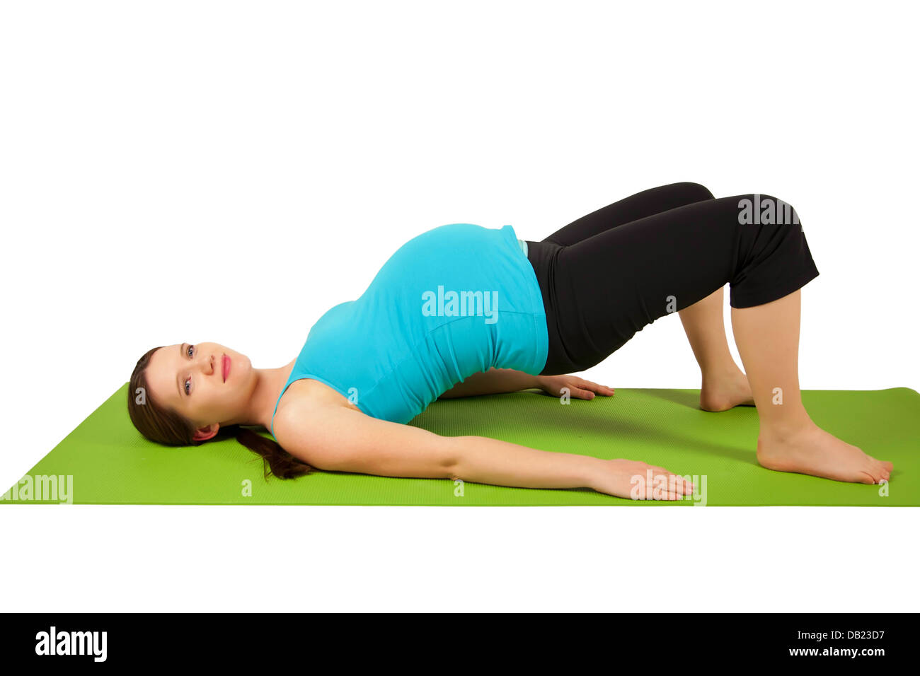 Schwangere junge Frauen dehnen und trainieren. Stockfoto