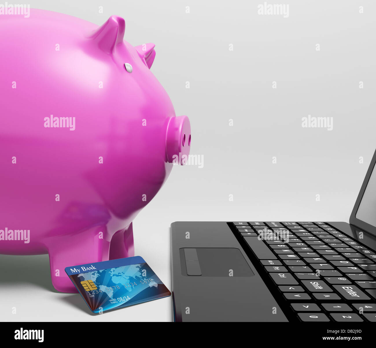 Piggy am Computer zeigt sparen On line Stockfoto