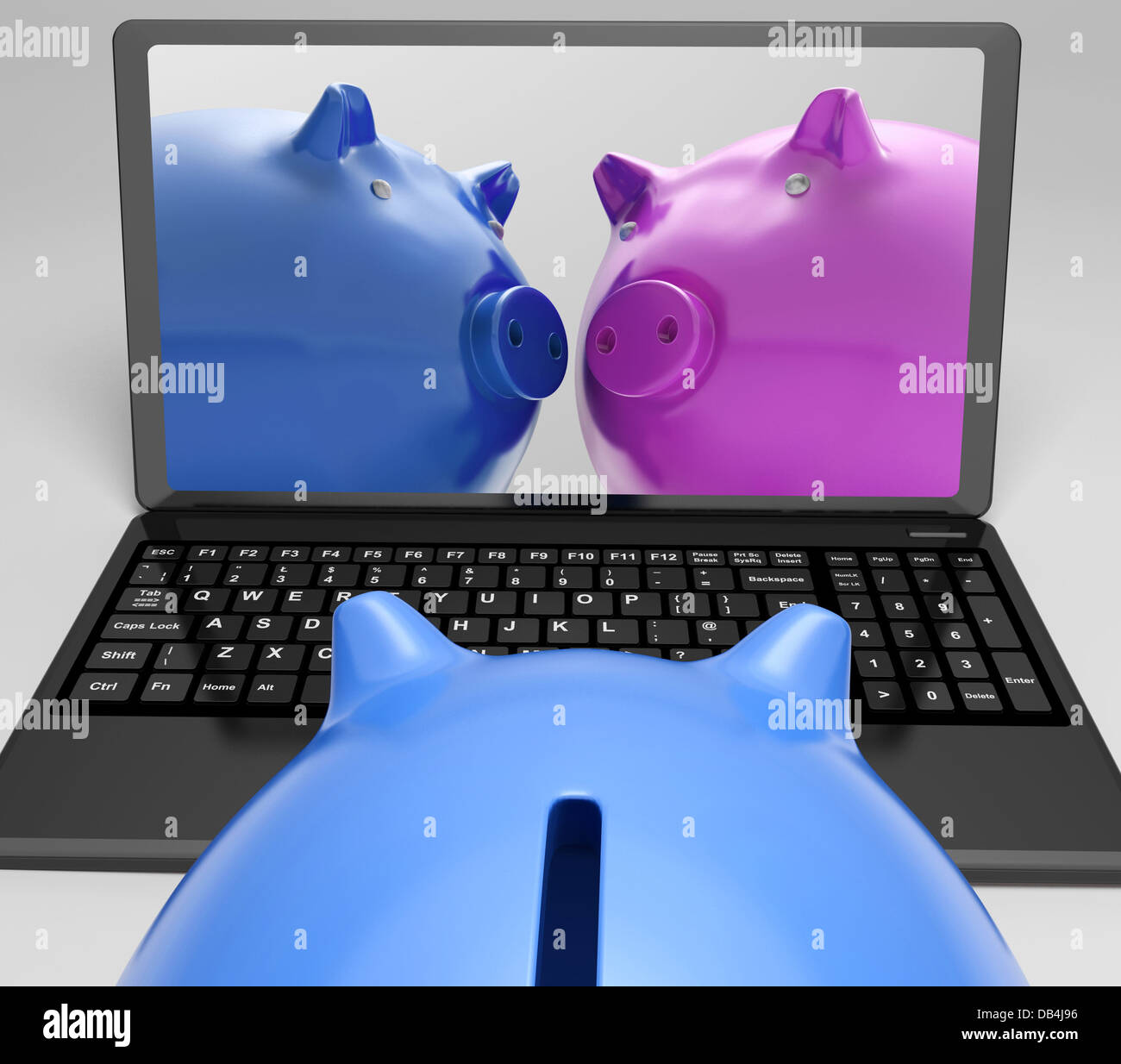 Sparschweine auf Notebook zeigt Online-Transaktionen Stockfoto