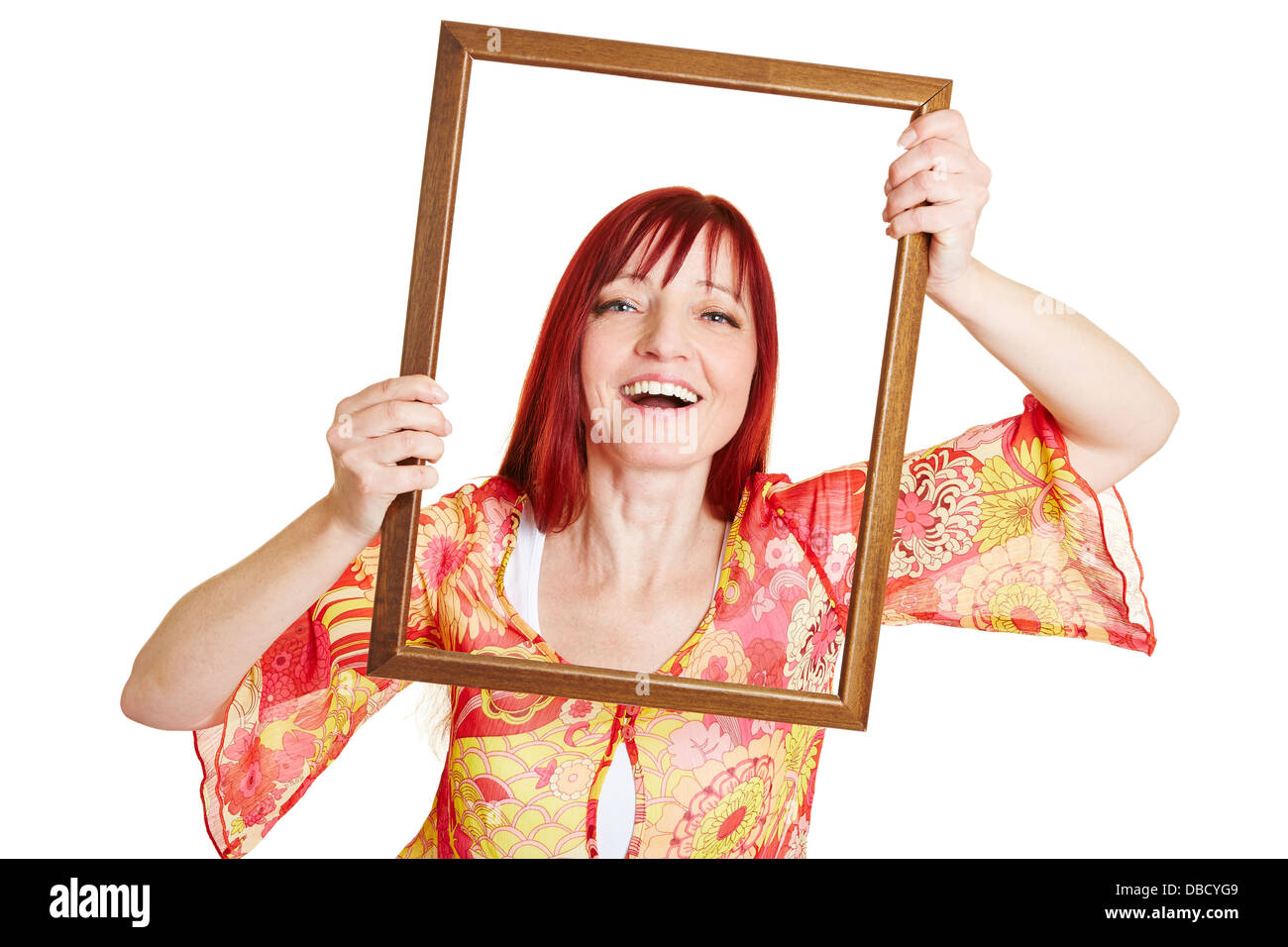 Glücklich best Ager-Frau mit leeren Grafikrahmen vor ihr Gesicht Stockfoto