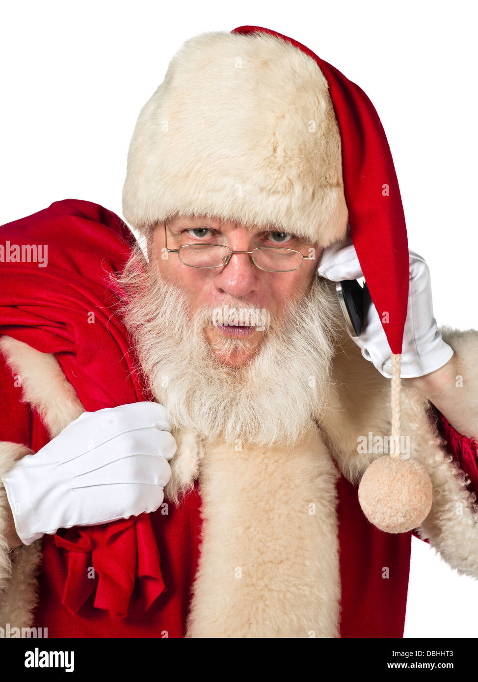 Santa mit Mobiltelefon und Geschenk Stockfoto