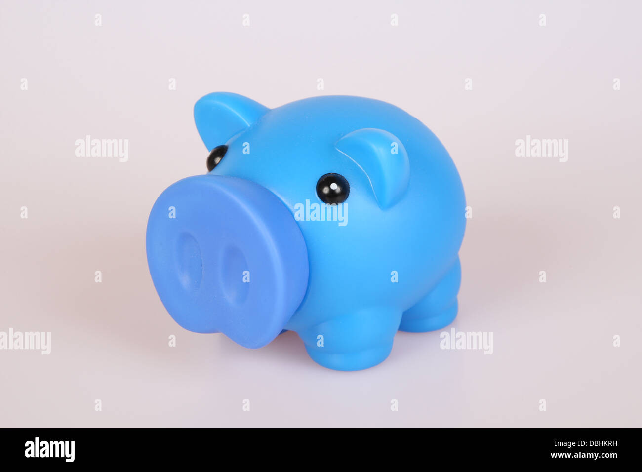 Piggy Bank in blauem Kunststoff Stockfoto