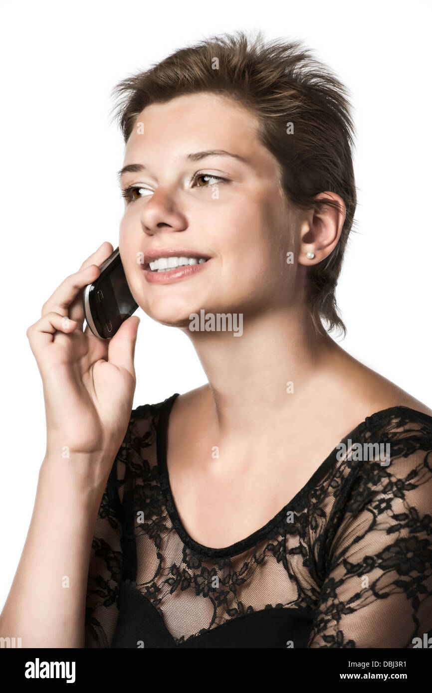 Mädchen telefonieren mit dem Handy in das Abendkleid, isoliert auf weißem Hintergrund Stockfoto