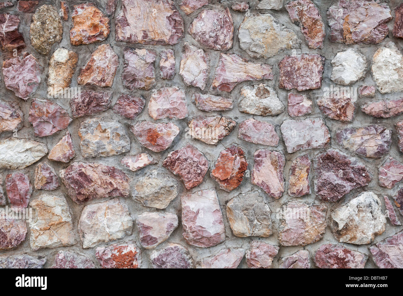 Alte rote Steinmauer Hintergrundtextur Stockfoto