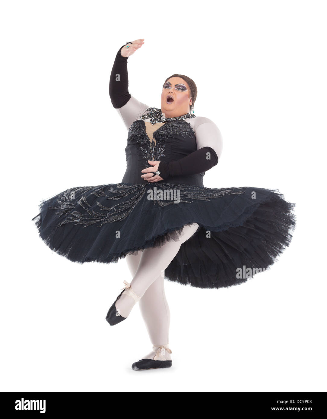 Übergewicht Drag Queen tanzen in einem Tutu flink balancieren auf Zehenspitzen mit seinen Fuß in eine lustige Karikatur eines weiblichen Balletts Stockfoto