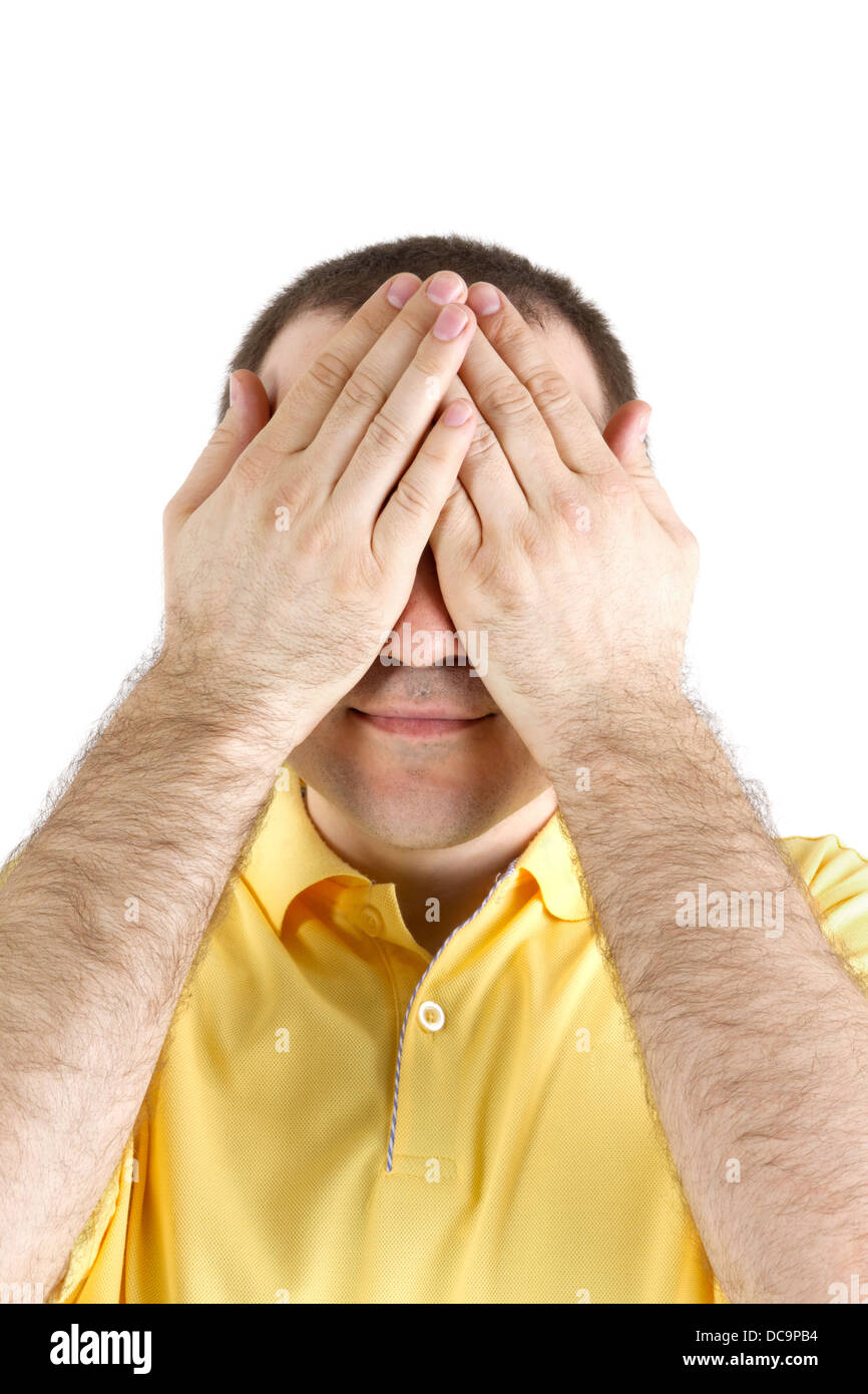 Man schließt die Augen mit den Händen auf einem weißen Hintergrund Stockfoto