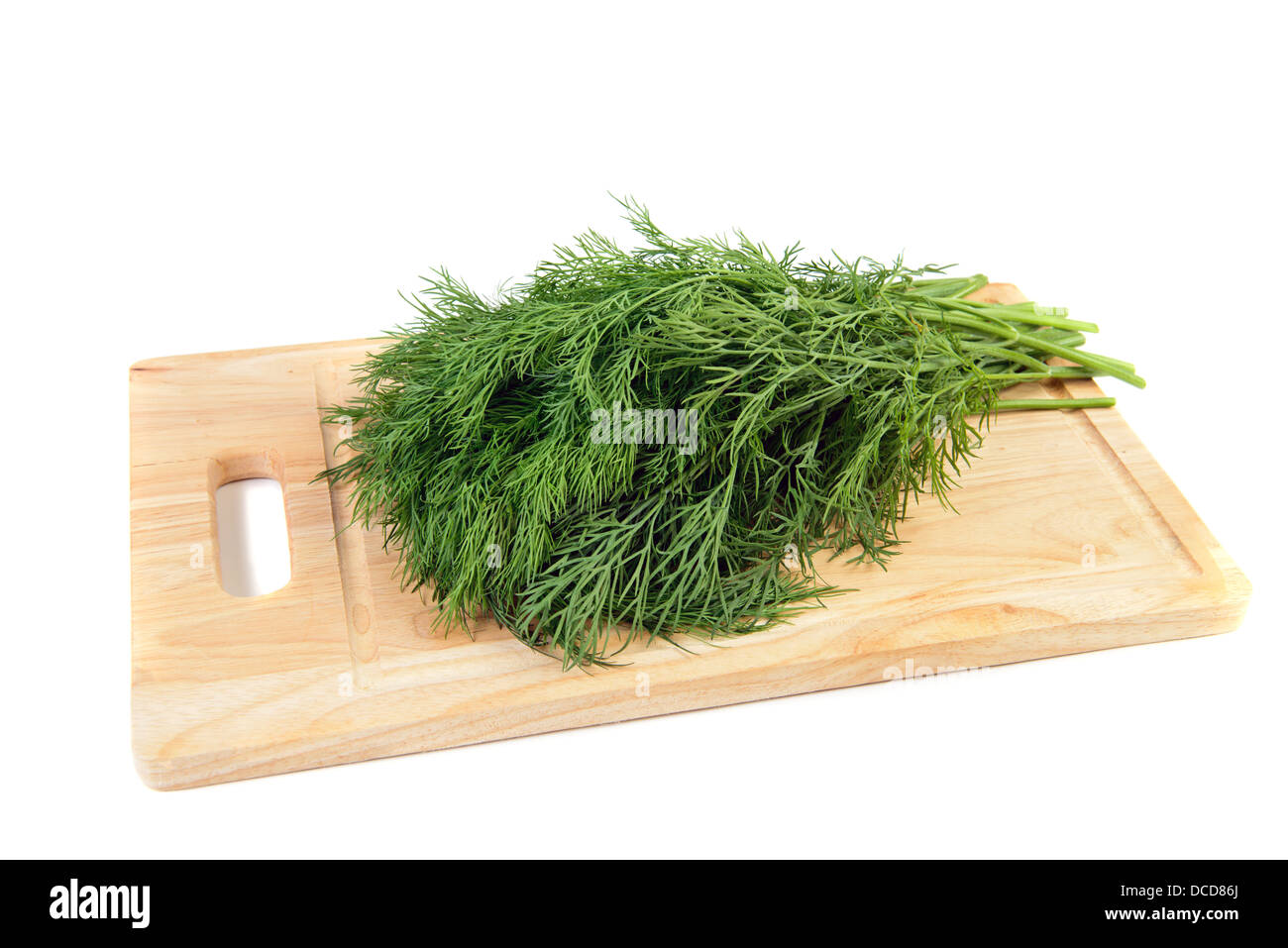 Frischer grüner Dill Küche Board isoliert auf weiß Stockfoto