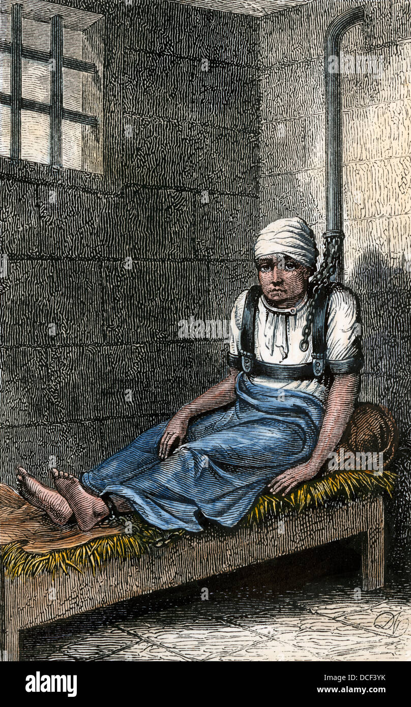 Psychisch kranke Gefangene Norris angekettet in seiner Zelle für 12 Jahre, New York City, 1870. Hand - farbige Holzschnitt Stockfoto