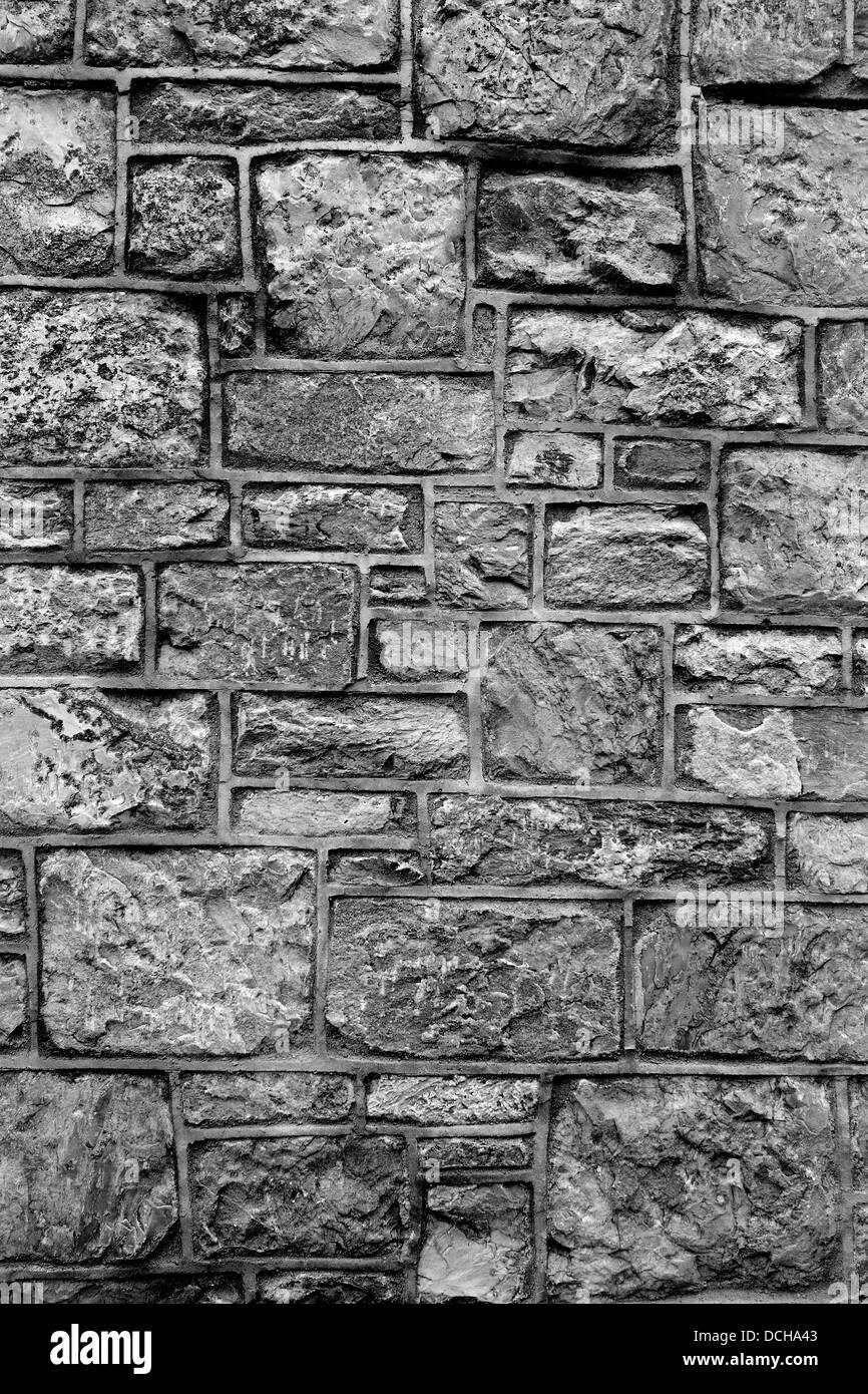 graue Struktur des Granitsteins bilden Block Arbeit für eine Wand Stockfoto
