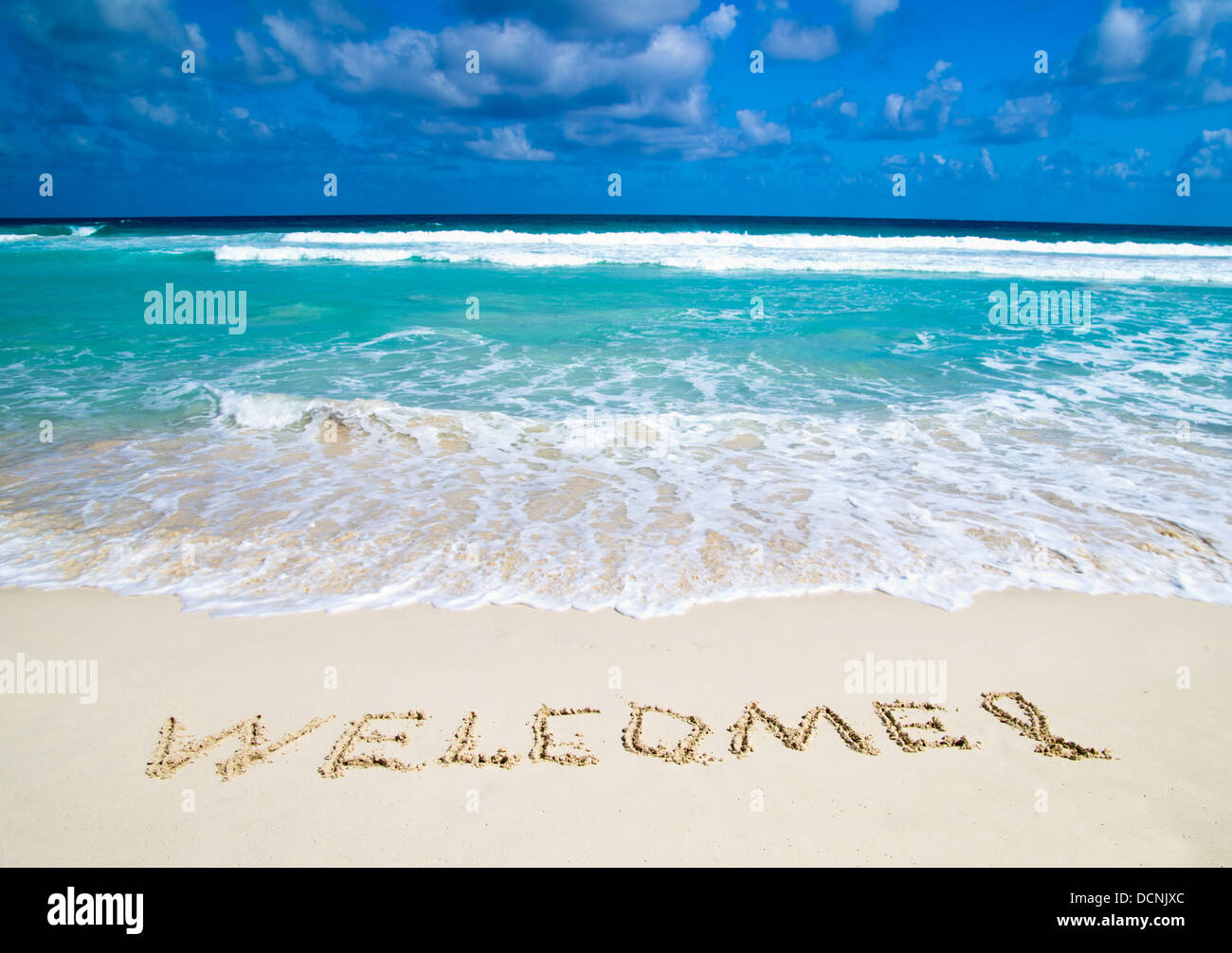 Willkommen im Strand geschrieben Stockfoto