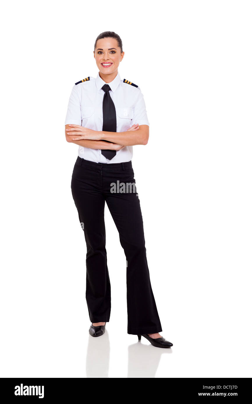 schöne weibliche junge Airline Co-Pilot mit verschränkten Armen isoliert auf weiss Stockfoto