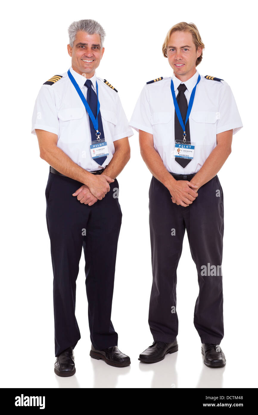 fröhlichen senior Flugkapitän und der erste Offizier auf weißem Hintergrund Stockfoto