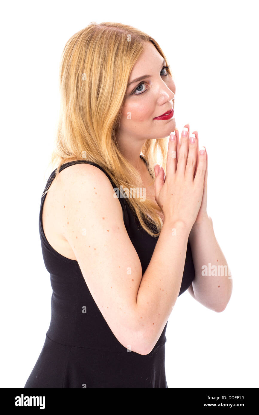 -Modell veröffentlicht. Attraktive junge Frau beten Stockfoto