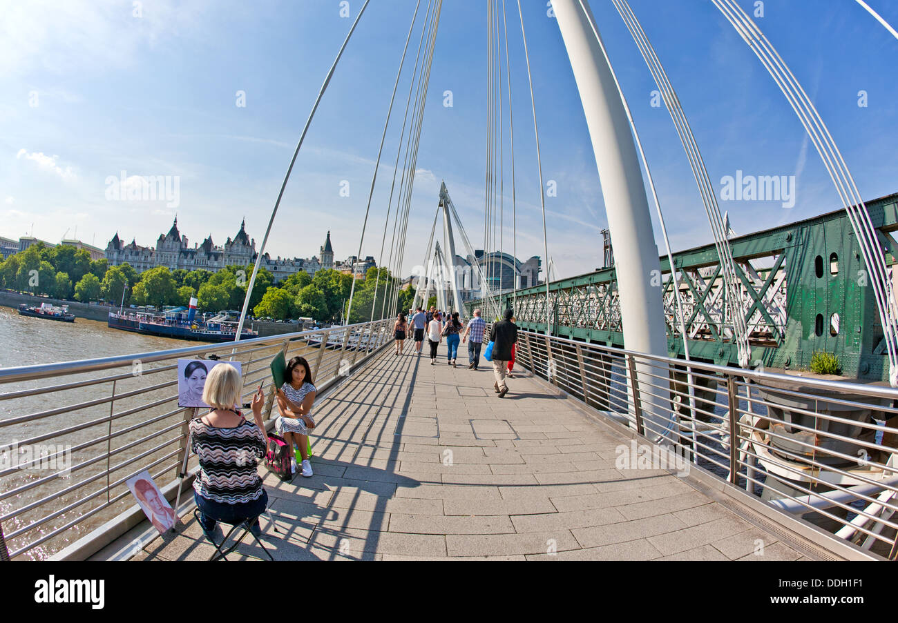 Künstler malen Portraits auf Hungerford Bridge London UK Stockfoto