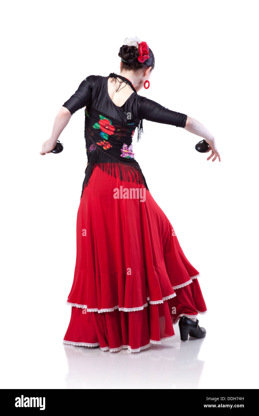 junge Frau tanzt Flamenco mit Kastagnetten isoliert auf weiss Stockfoto