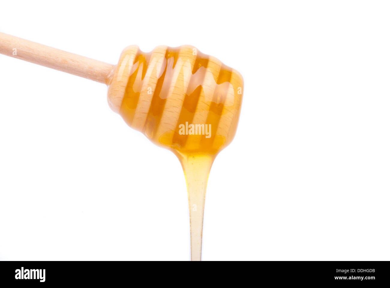 Honig vom Löffel Honig tropft. Stockfoto