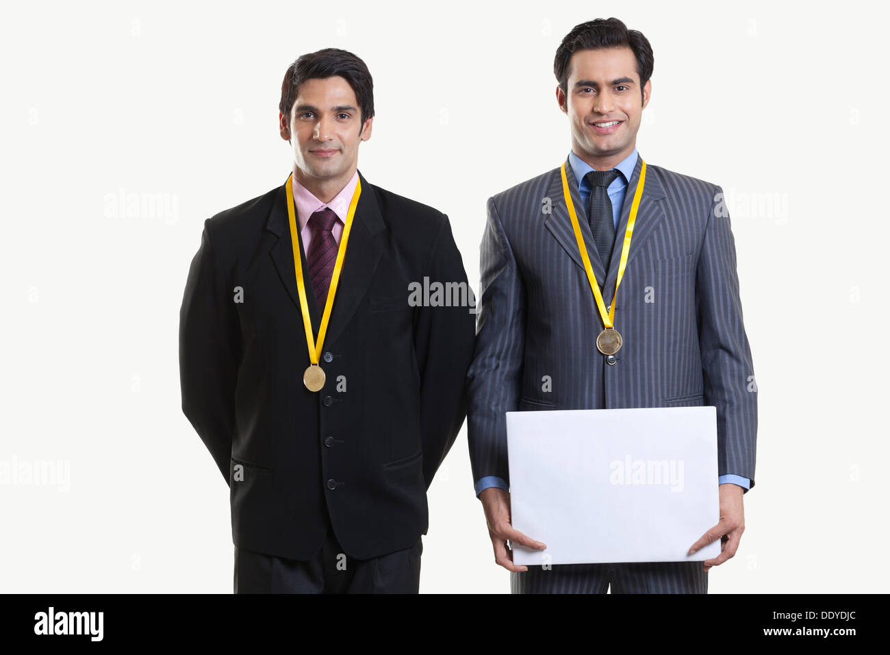 Geschäftsleute mit Medaillen Stockfoto