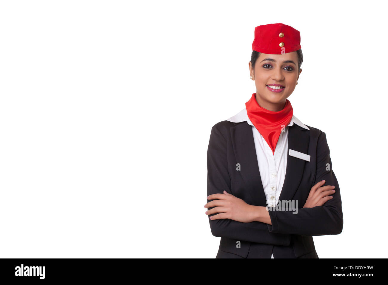 Porträt von einem zuversichtlich Stewardess vor weißem Hintergrund stehen Stockfoto