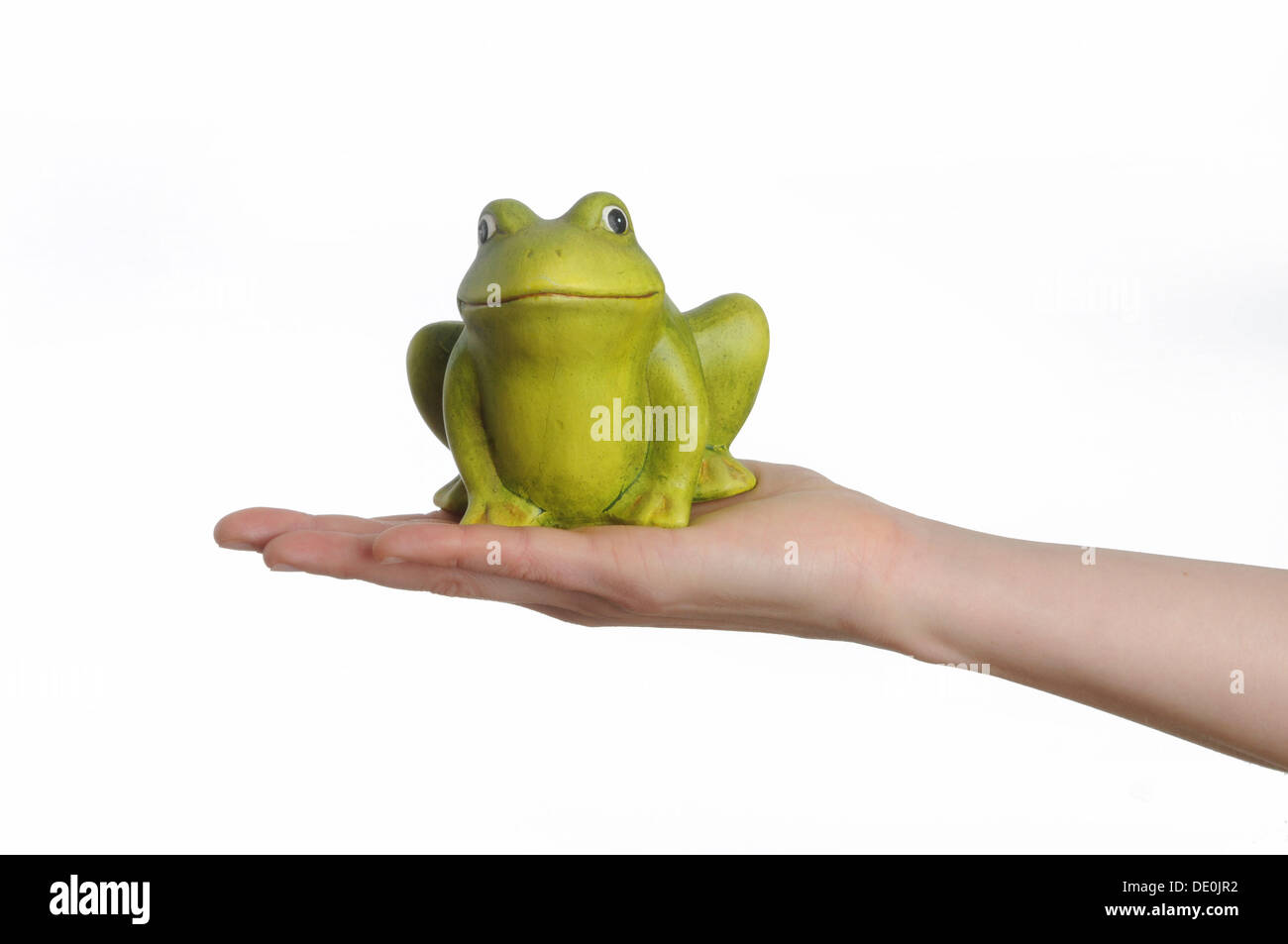 Hand, die einen künstliche Frosch Stockfoto