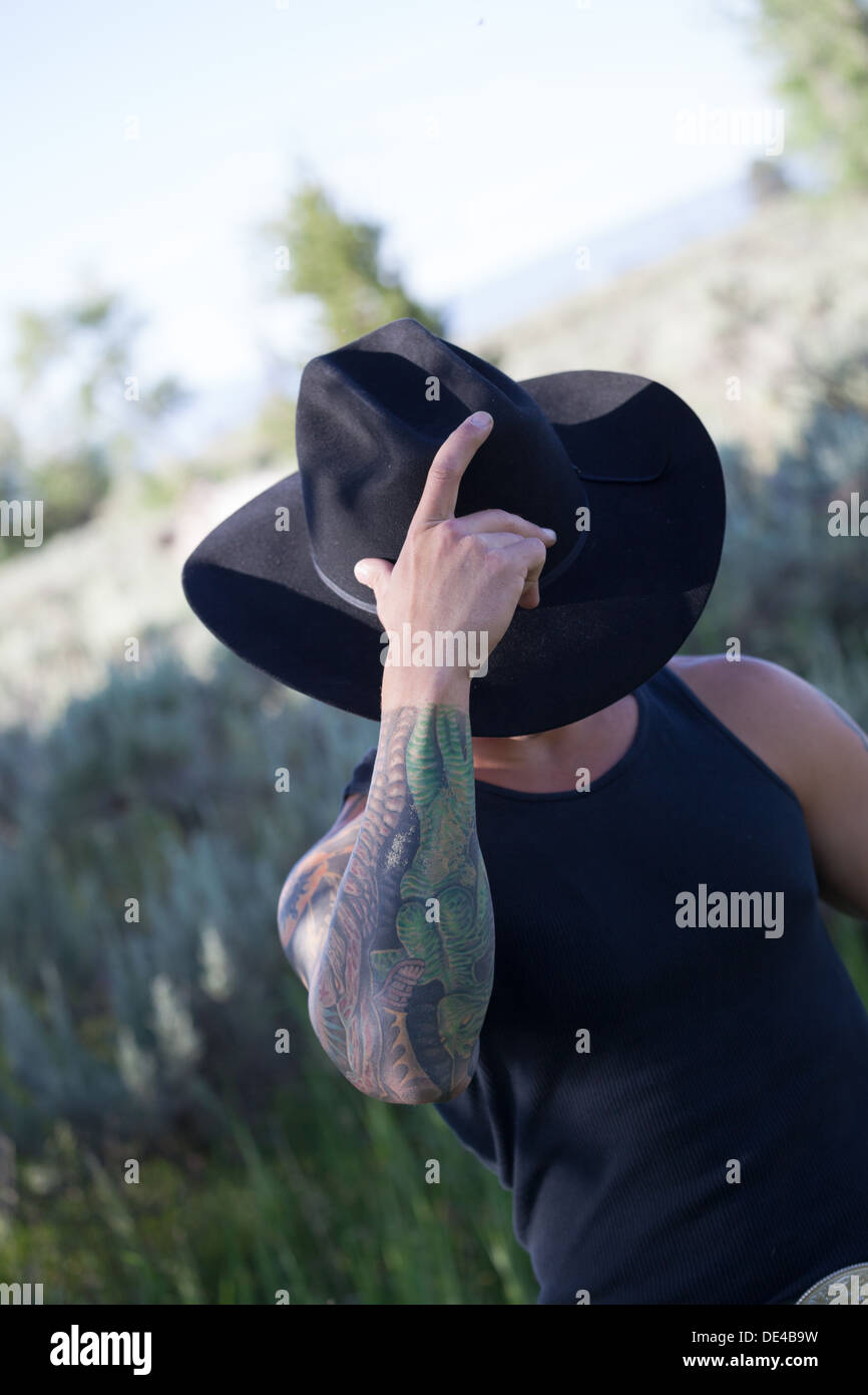 Macho Montana Cowboy in schwarzer Stetson Hut Stockfoto