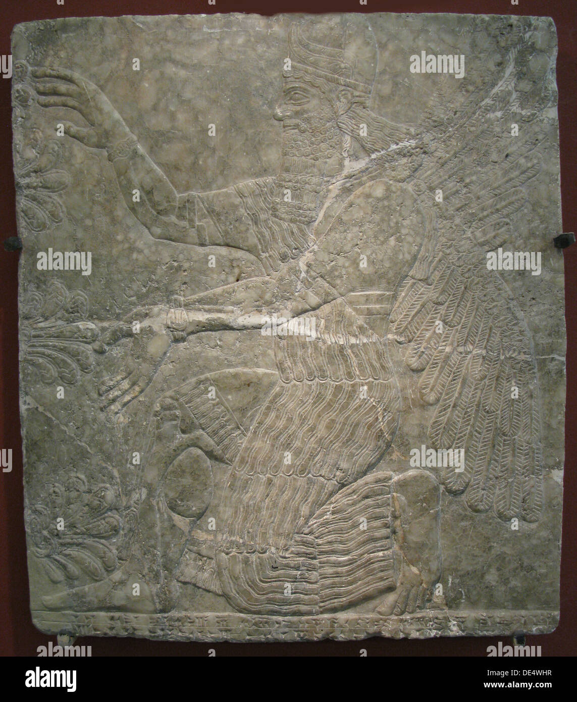Winged Gottheit durch den heiligen Baum. Befreiung von den Palast von ASSURNASIRPAL II in Kalhu, Nimrud, dem 9. vorchristlichen Jahrhundert. Artist: Assyrische Kunst Stockfoto