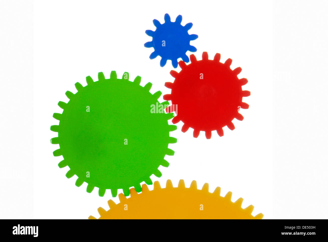 Zahnräder mit verschiedenen Farben und Größen, symbolisches Bild für die Zusammenarbeit Stockfoto