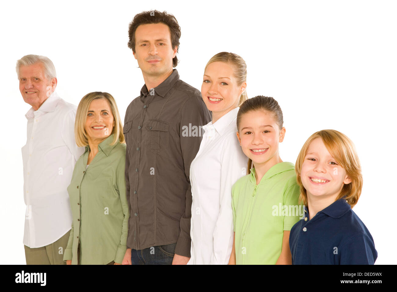 drei Generationen Familie stehen isoliert auf weißem Hintergrund Stockfoto
