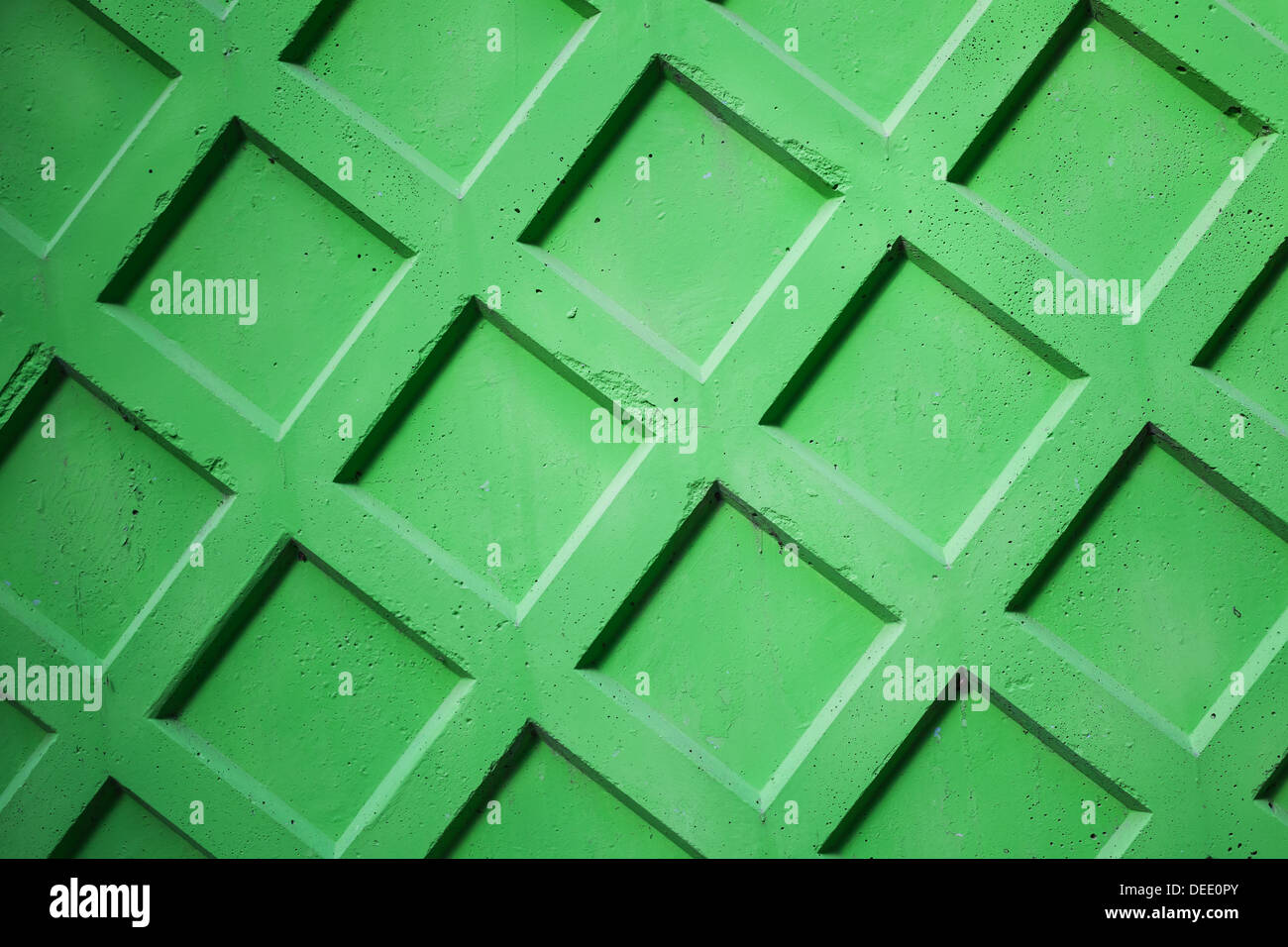 Abstrakte Fototextur der hellen grünen Betonzaun Mauer Stockfoto