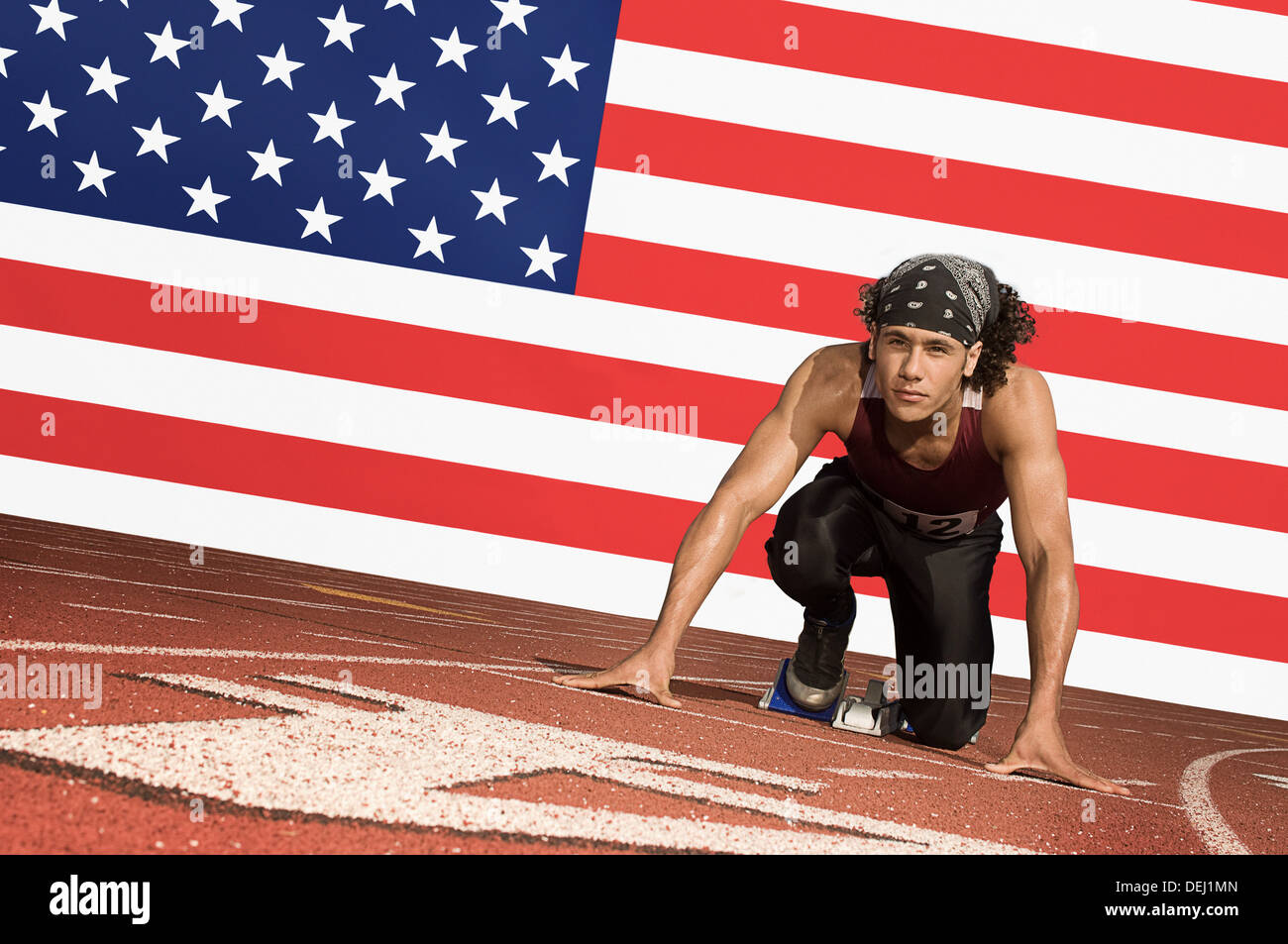 Läufer auf eine Strecke Startblock vorne US Flagge Stockfoto
