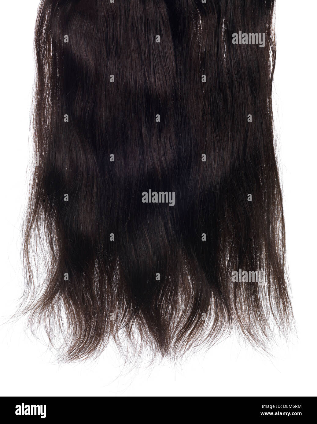 Dunkelbraunes Haar Extensions mit Echthaar isoliert auf weißem Hintergrund Stockfoto