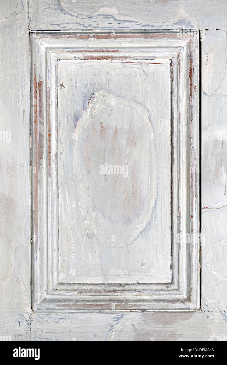Alten distressed Holz Türverkleidung mit abblätternde Farbe als gerahmte Hintergrund Stockfoto