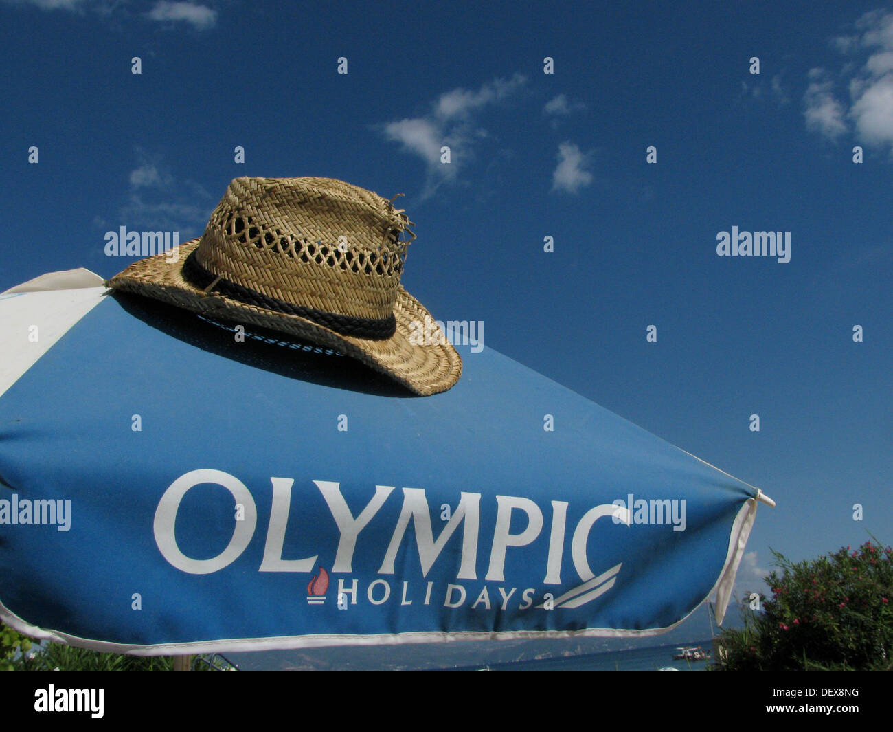 Urlaub mal Hut Olympia Reisen Regenschirm Stockfoto