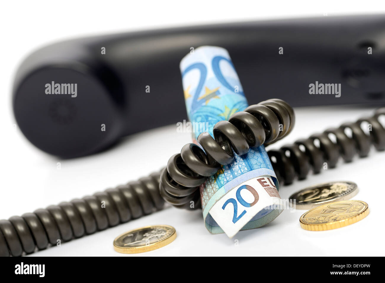 Telefon mit monetären Münzen und Geldscheine symbolische Foto warten Schleife kostenpflichtig, Telefon Mit Geldschein Und Geldmünzen, Sy Stockfoto