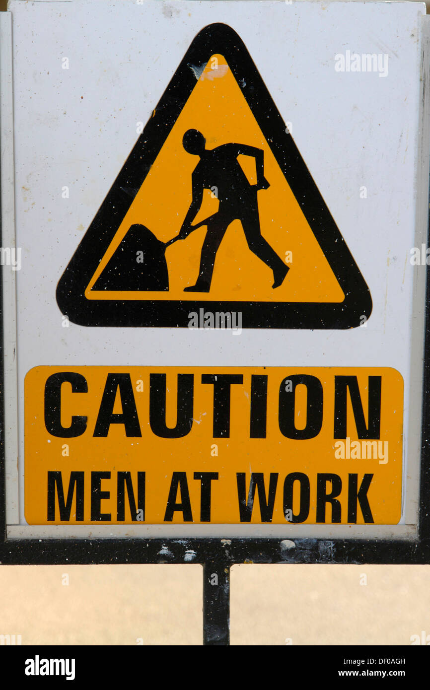 Warnschild, Achtung, Männer bei der Arbeit Stockfoto
