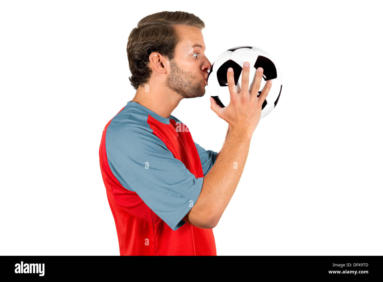 Football-Spieler küssen eine Kugel isoliert in weiß Stockfoto