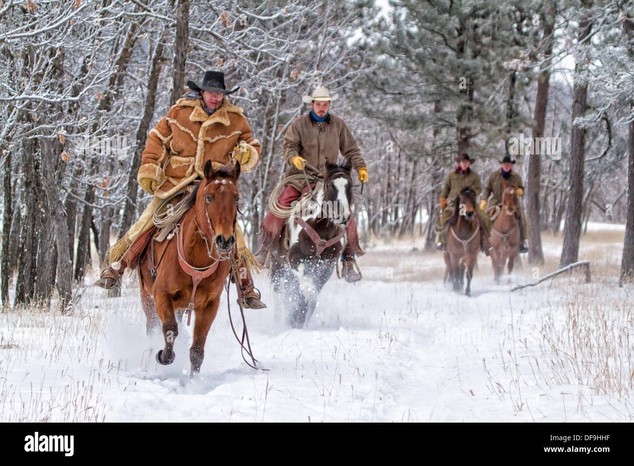 Four Cowboy Riders Four Cowboys Riding In Snow Stockfotos & Four Cowboys Riding In Snow ...