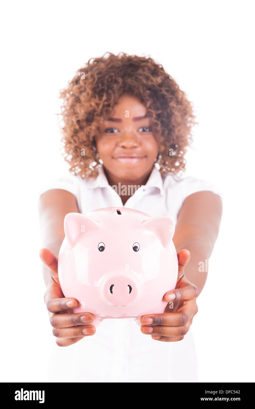 Happy Young Woman spart Geld im Sparschwein isoliert Stockfoto