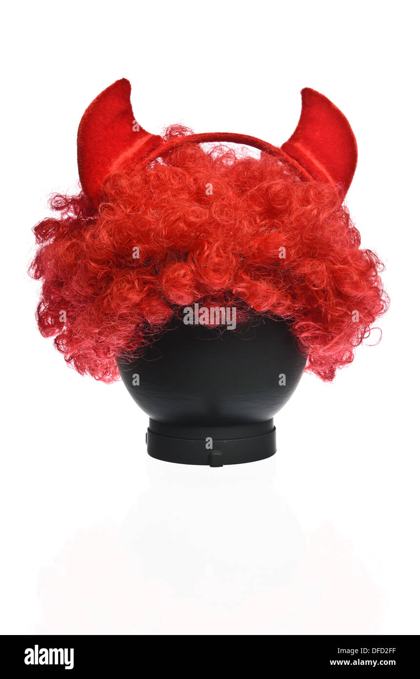 Rote Clown Perücke mit roten Hörnern Stockfoto