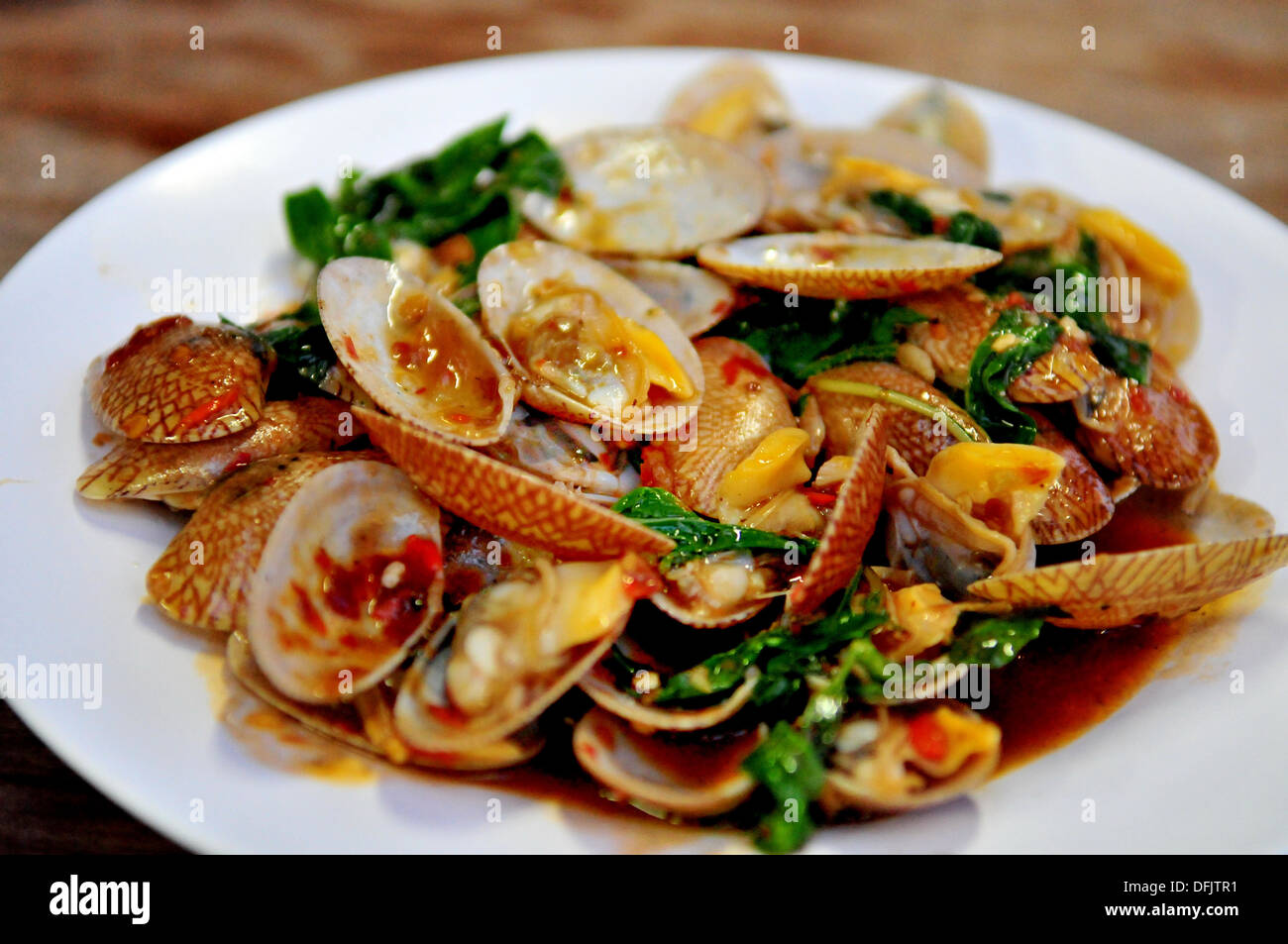 Geschmack von Thailand - Saute Muscheln mit Chili-Paste (Hoi Lai Phad Nam Prik Phao) Stockfoto