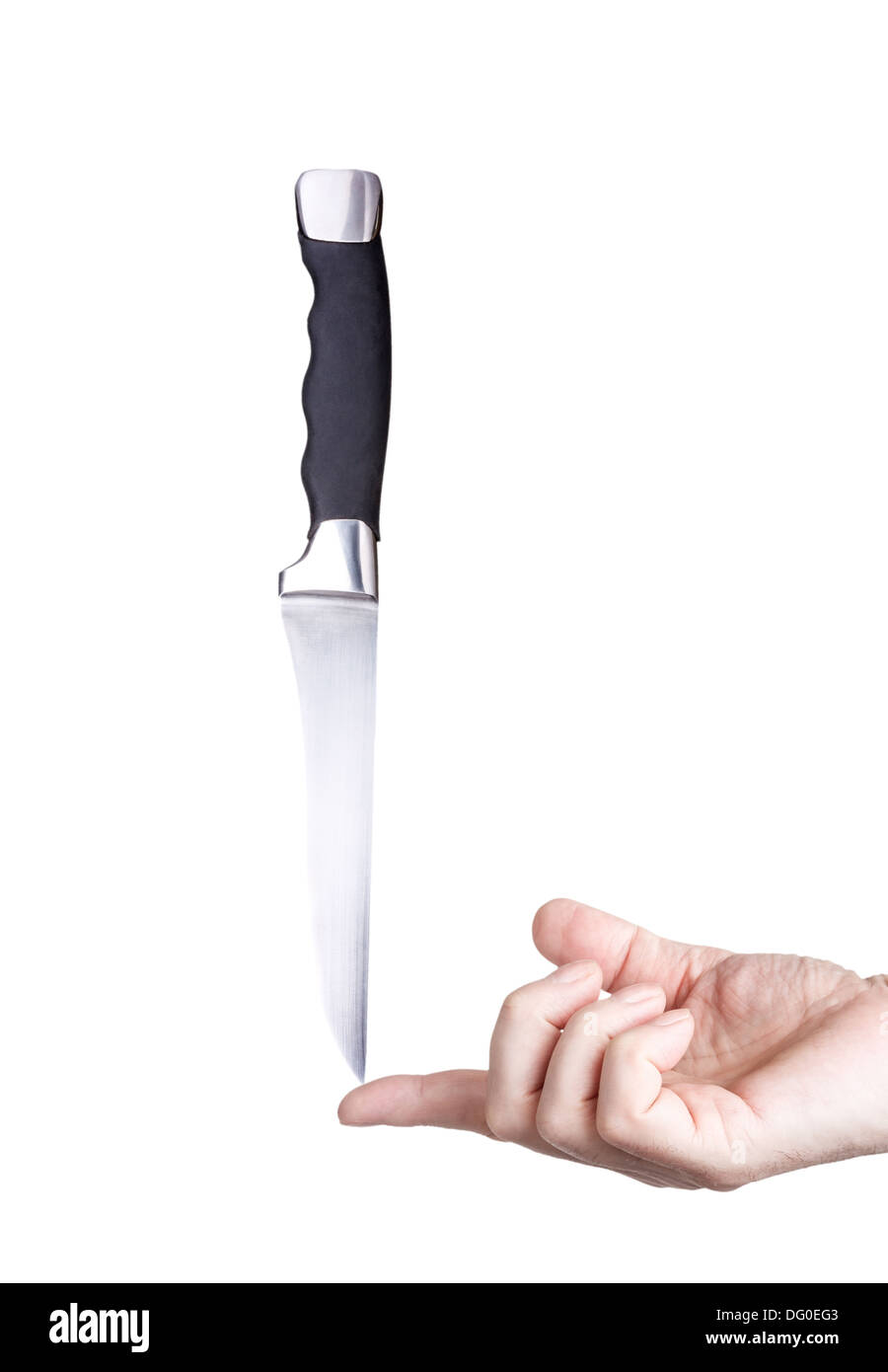 Magische Chef Stahl Messer ausgeglichen auf dem Finger isoliert auf weißem Hintergrund Stockfoto