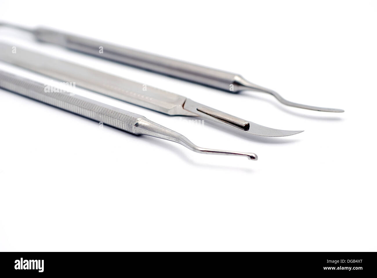 Werkzeuge-Zahnarzt aus Skalpell, Plugger und Rolltreppe Stockfoto