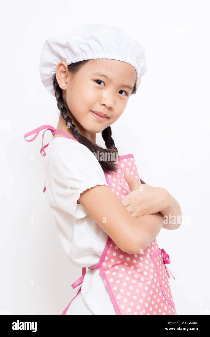 Kleine asiatische süß Chef trägt rosa Schürze Stockfotografie - Alamy