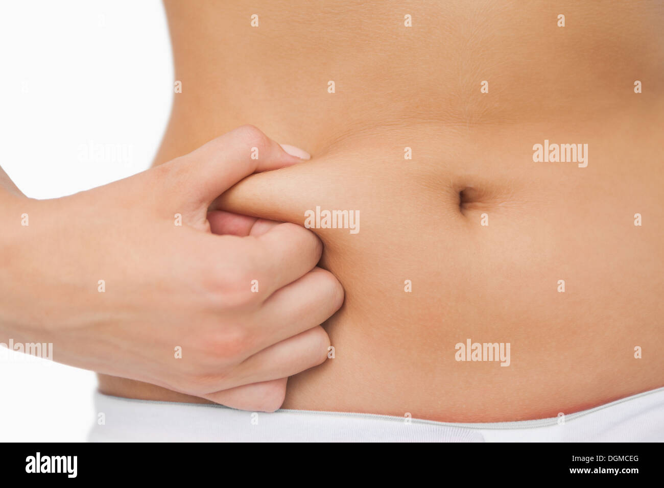 Junge schlanke Frau mit wenig Fett am Bauch Stockfoto