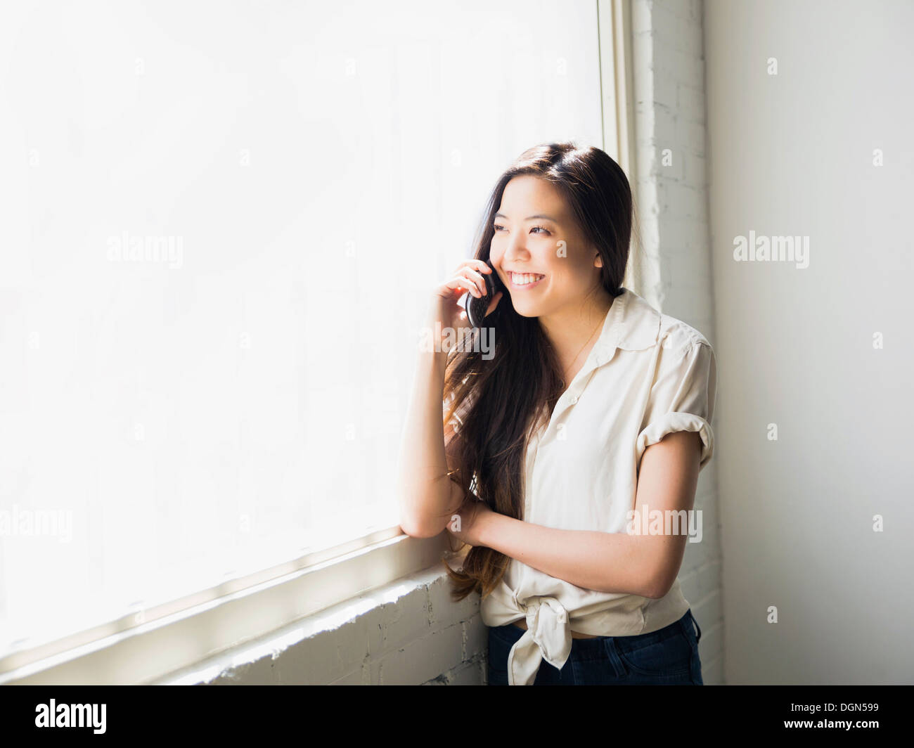 Frau am Telefon Stockfoto