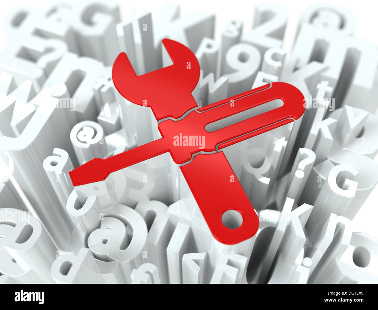 Schraubenschlüssel und Schraubendreher auf Alphabet Hintergrund. Stockfoto